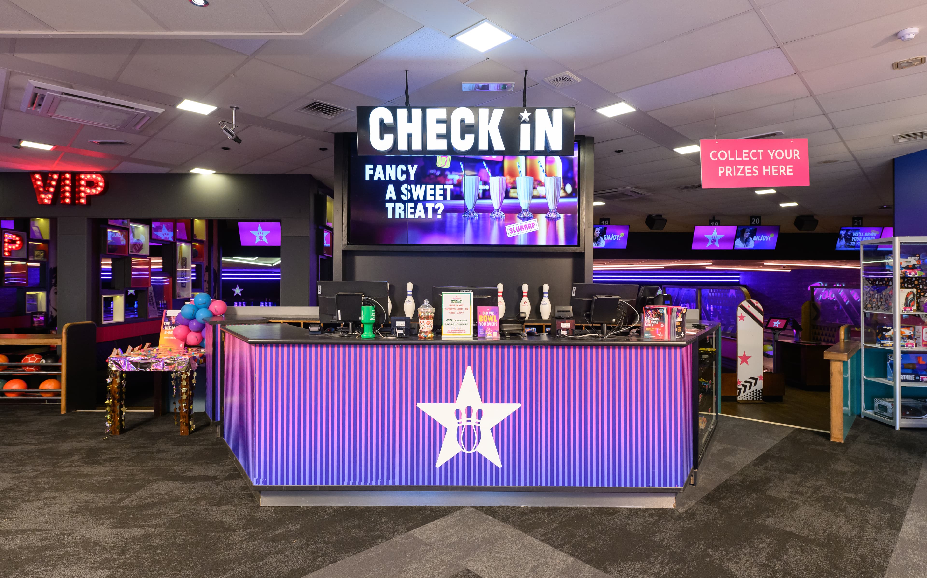 The front check in desk. Behind it are the bowling lanes.